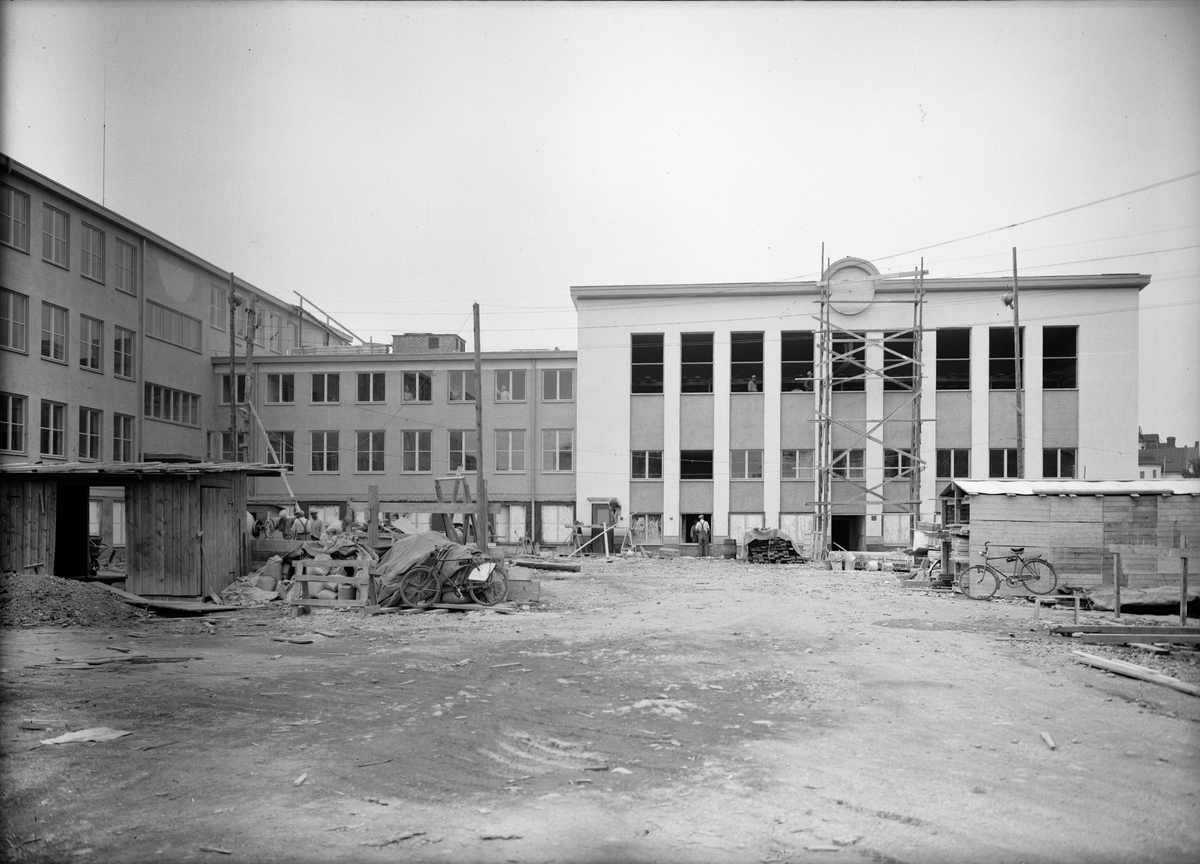 Praktiska mellanskolan och högre folkskolan under byggnation, Götgatan. Fasaden mot Geijersgatan