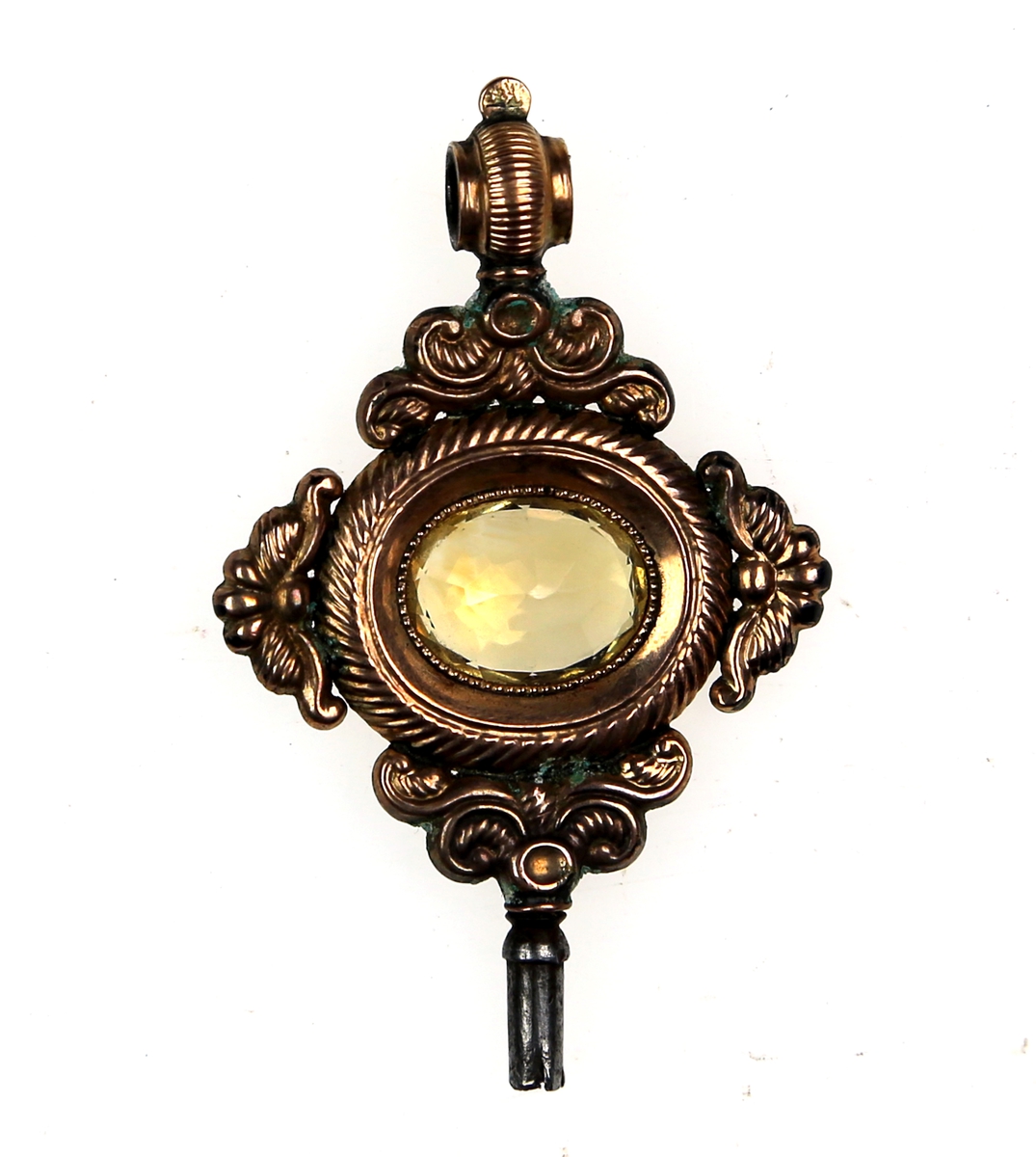 Nøkkel støpt i messing eller kobber med fasettslipt glass eller sten som dekor i midten
