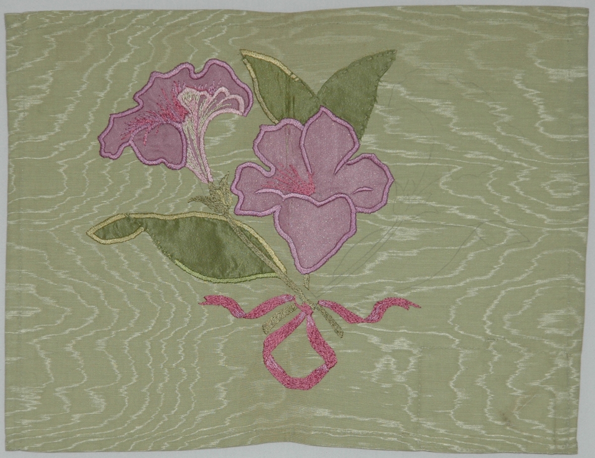 Broderi på ljusgrön sidenmoiré med applikation av grönt och violett siden och plattsöm i silke.