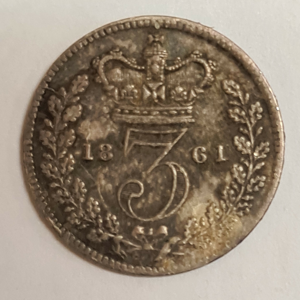 2 mynt från Storbritanien.
3 Pence, 1861