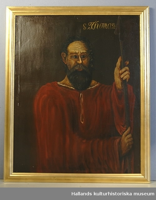 Oljemålning på duk. Aposteln Tomas med röd mantel och gråsvart skägg och en lans.
