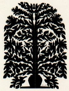 Motivet är klippt i svart papper och föreställer en stor blomma i kruka.
