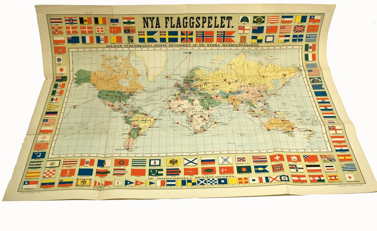 Spelkarta, spelunderlag för "Nya flaggspelet".
Tryckt 1879. Kartan kantas av flaggor.
