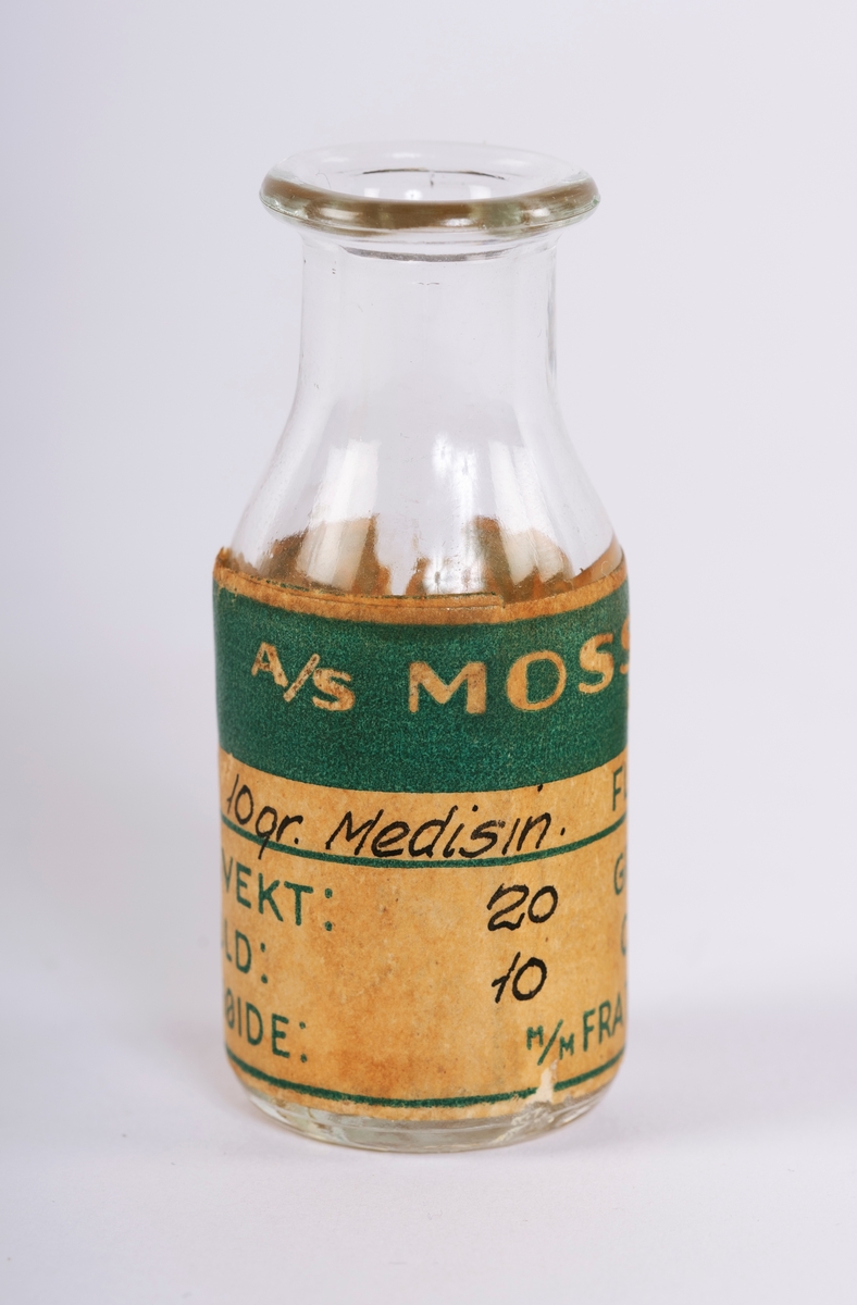 To sylindriske, små medisinflasker fra Moss Glasværk - en i brunt og en i klart glass.