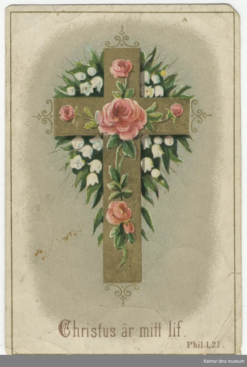Guldkors med rosor och stora konvaljer. Text under motivet: Christus är mitt lif.