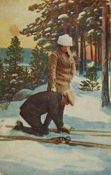 Julekort. Jule-og nyttårshilsen. Kvinne og mann på ski i sko