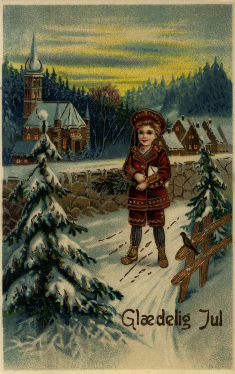 Julekort. Julehilsen. Vintermotiv. Landskap med kirke og bebyggelse. En gutt står utenfor kirkemuren.