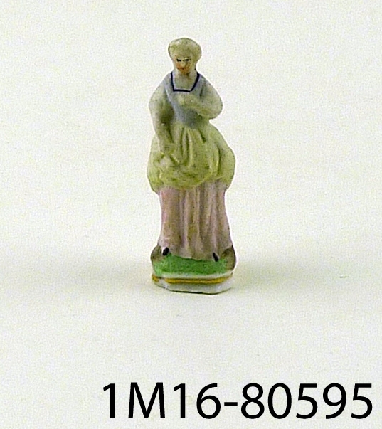Figurin, kvinna i rokokodräkt.