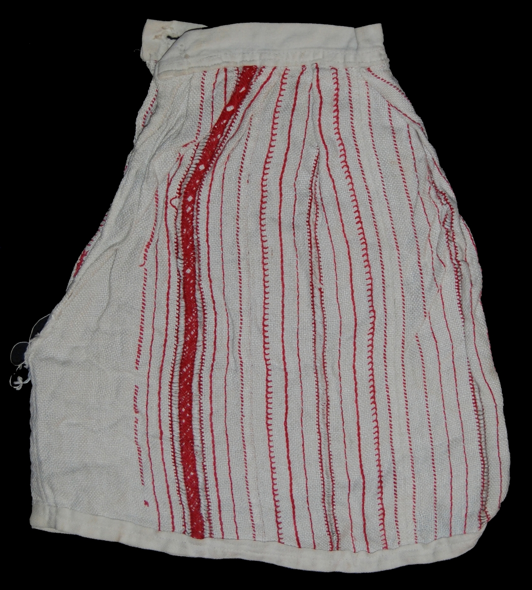 Kjol för docka, vitt linne. Broderade röda ränder.