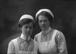 Gruppeportrett, to sykepleiere.