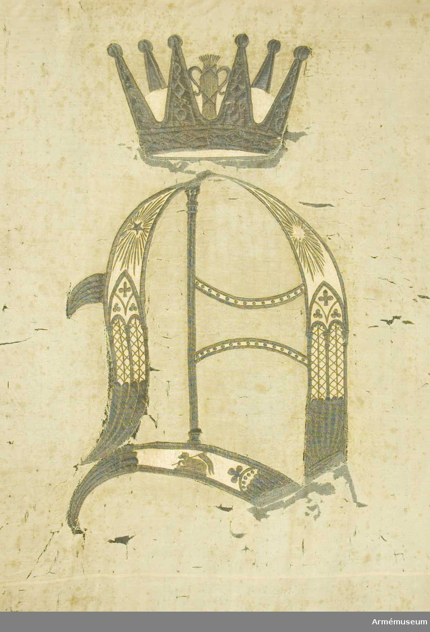 Duken vit med i guld broderat anglosachsiskt O under furstlig krona. På tillhörande lapp av äldre modell anges att Visby stads beväringsbataljon erhöll fanan 1832.