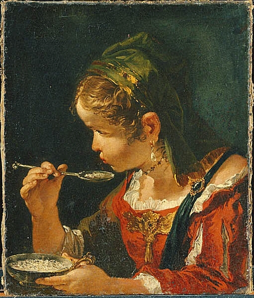 Flicka som äter ur en skål