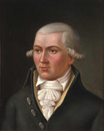 Portrett av Hans C U Midelfart. Grått hår (parykk), mørk kjol (jakke), gul vest, hvit skjorte og halstørkle.