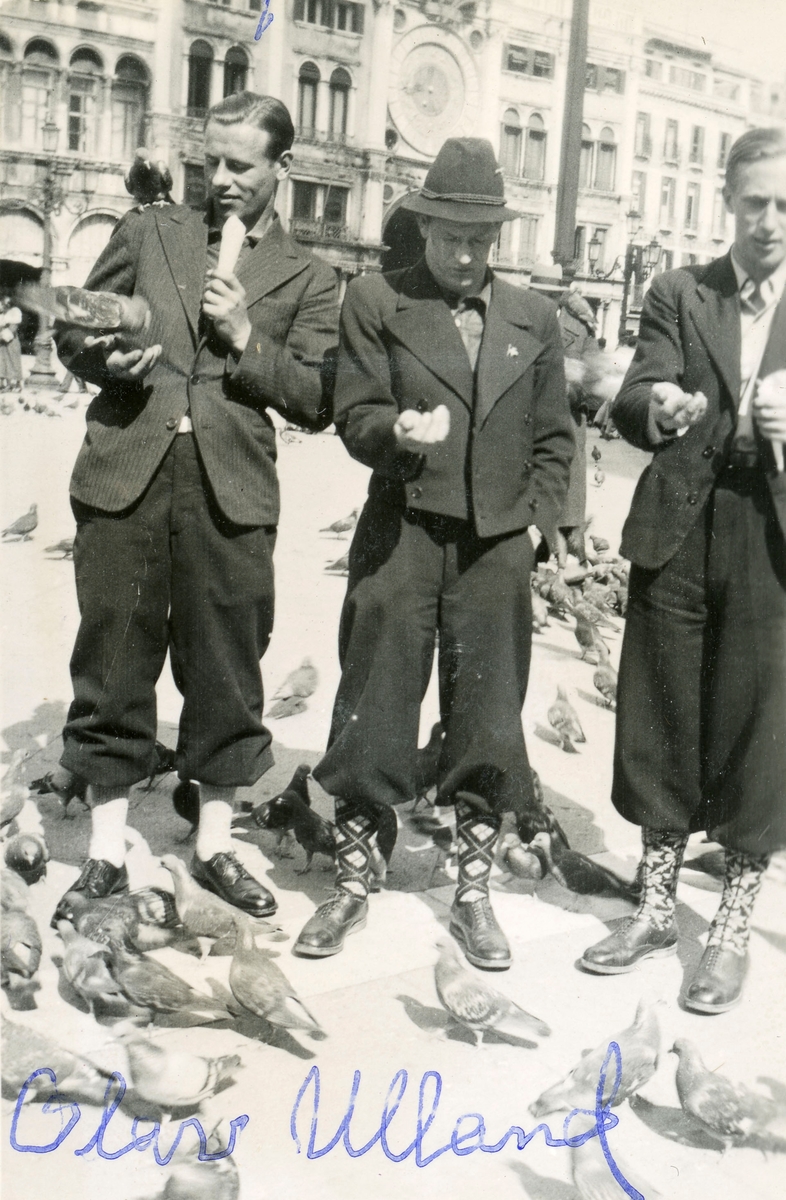Norwegian skiers feeding pigeons