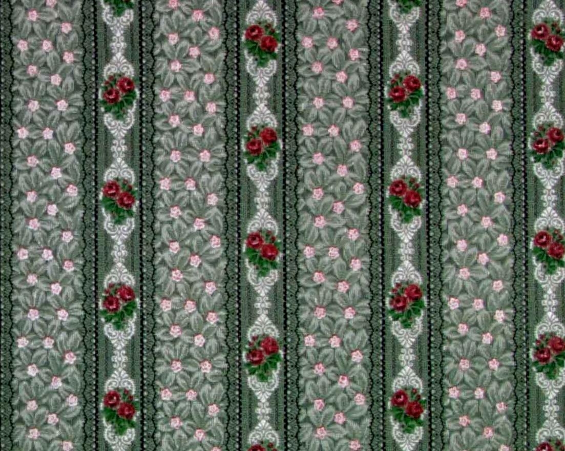 Lodrätta spetsbårder med wienerjugend dekor omväxlande med textilimiterande bårder. De senare bestående av ett tätt ytfyllande litet blommönster. Tryck i vitt, svart, rött, klargrönt och rosa. Grå-grönt genomfärgat papper.