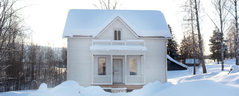 Bilde av Bjørgo-huset i dekket av snø