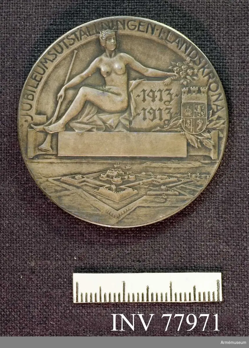 Grupp: M II.
Medalj, silver "Jubileumsutställingen i Landskrona 1913" "Gustaf Adolf Sveriges Kronprins Hertig av Skåne" (Gustaf VI Adolf som ryttmästare).
Graverad av Sven Kulle.