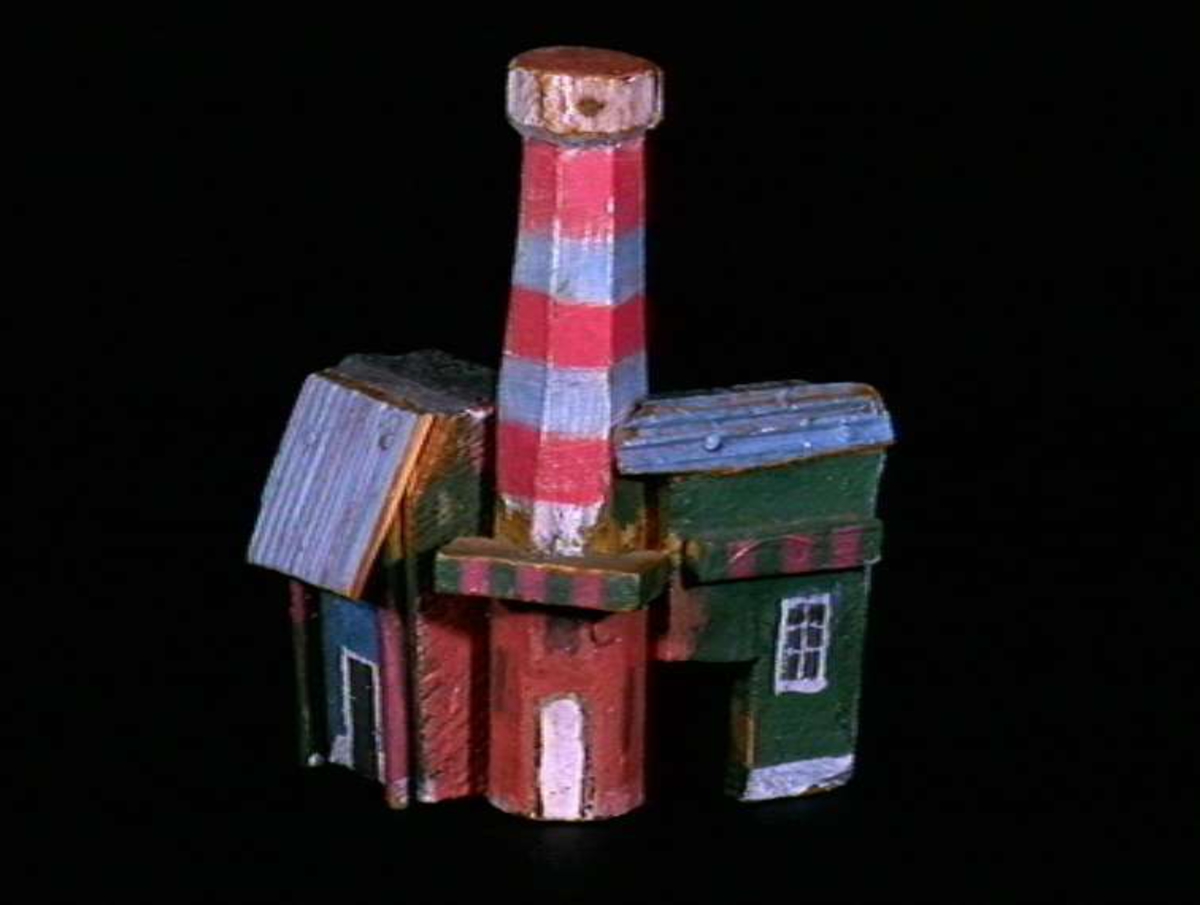 Sett med ca 200 leketøyhus laget av tre i forskjellige former og farger.